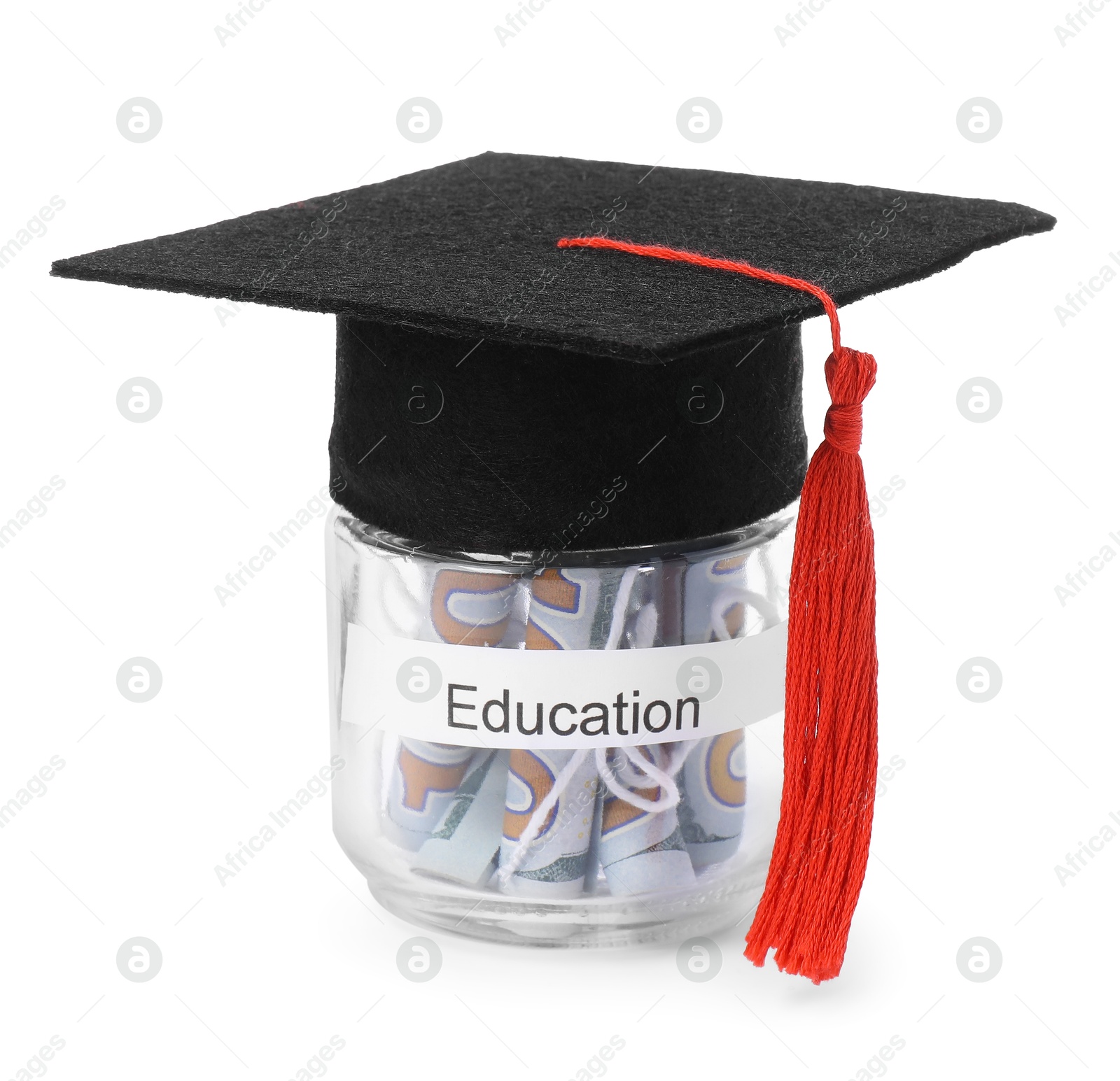 Photo of Graduate hat and dollar banknotes in glass jar with word Education isolated on white. Tuition payment