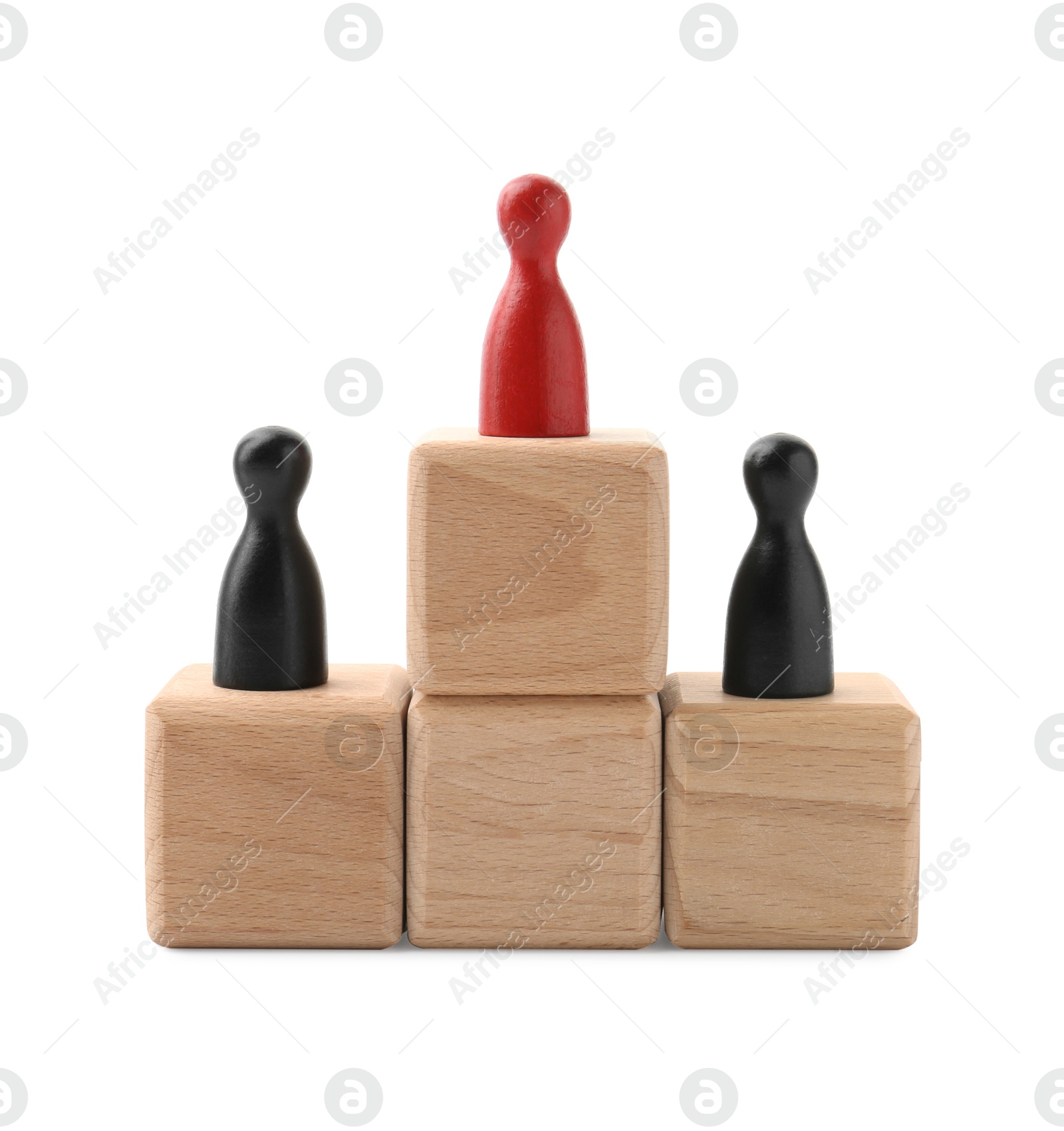 Photo of Human figures on wooden blocks, red one on top against white background. Competition concept