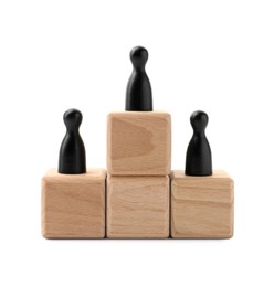 Photo of Black human figures on wooden blocks, one on top against white background. Competition concept