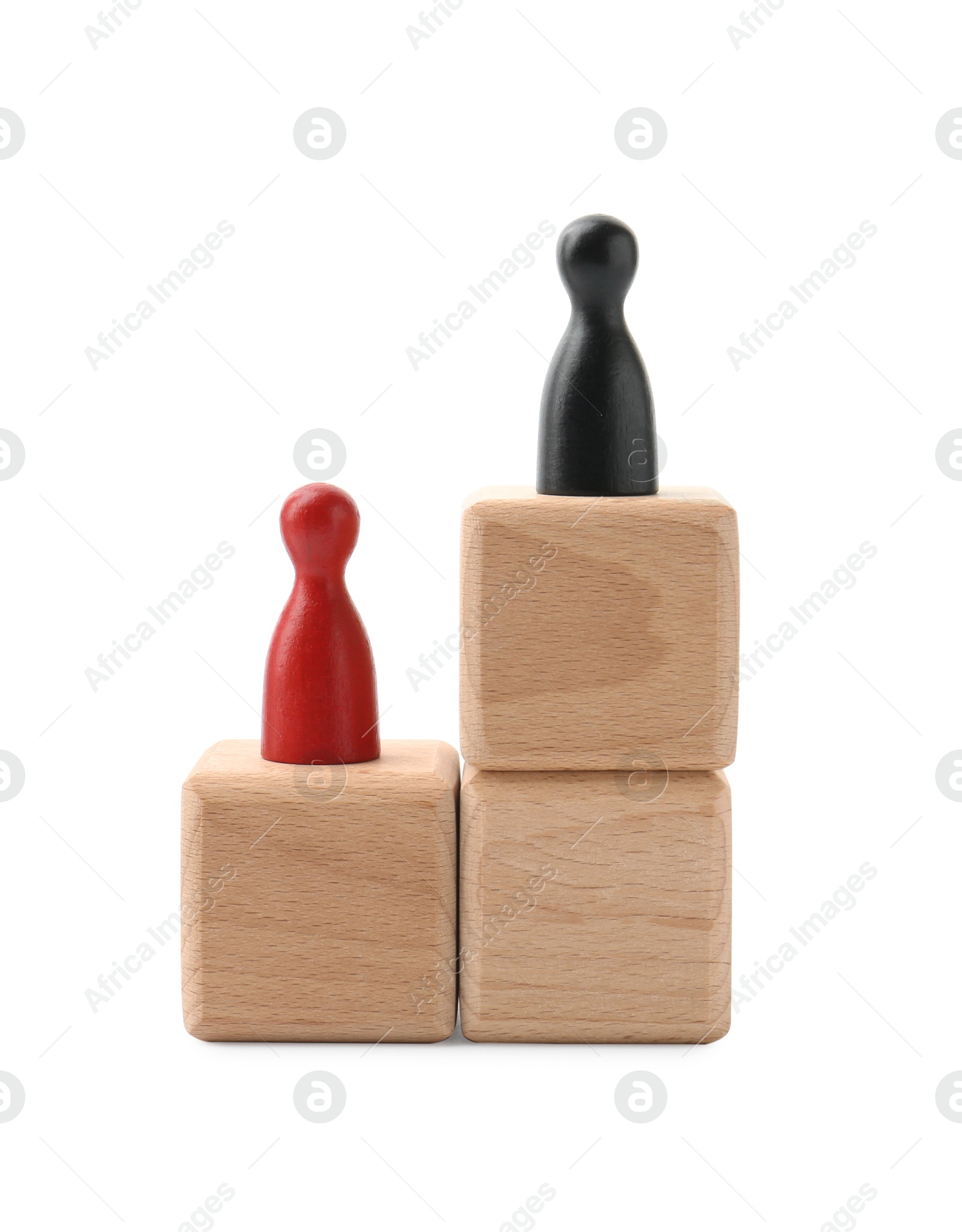 Photo of Human figures on wooden blocks, black one on top against white background. Competition concept