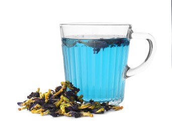 Photo of Delicious butterfly pea flower tea in glass mug and dry petals isolated on white