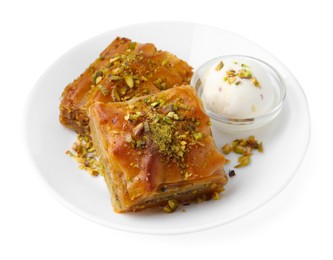 Photo of Tasty baklava with chopped nuts and scoop of ice cream isolated on white