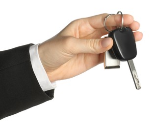 Photo of Woman with car key and keychain on white background, closeup