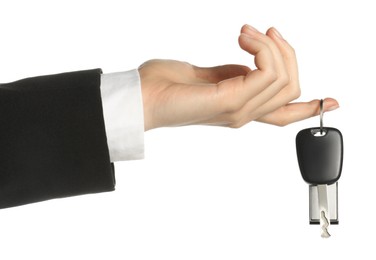 Photo of Woman with car key and keychain on white background, closeup