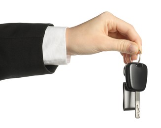 Photo of Woman with car key and keychain on white background, closeup