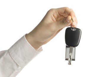 Photo of Woman with car key and keychain on white background, closeup