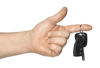 Man with car keys on white background, closeup