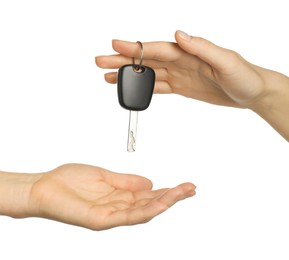 Photo of Dealer giving car key to customer on white background, closeup. Buying auto