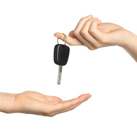 Photo of Dealer giving car key to customer on white background, closeup. Buying auto