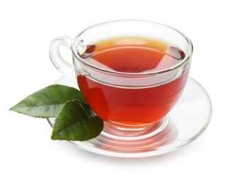 Photo of Refreshing black tea in cup and leaves isolated on white