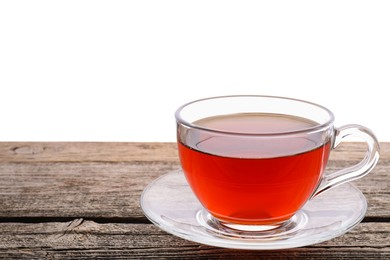 Photo of Refreshing black tea in cup on wooden table against white background