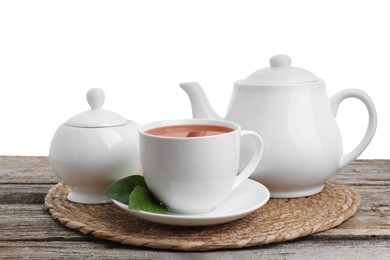 Refreshing black tea and sugar on wooden table against white background