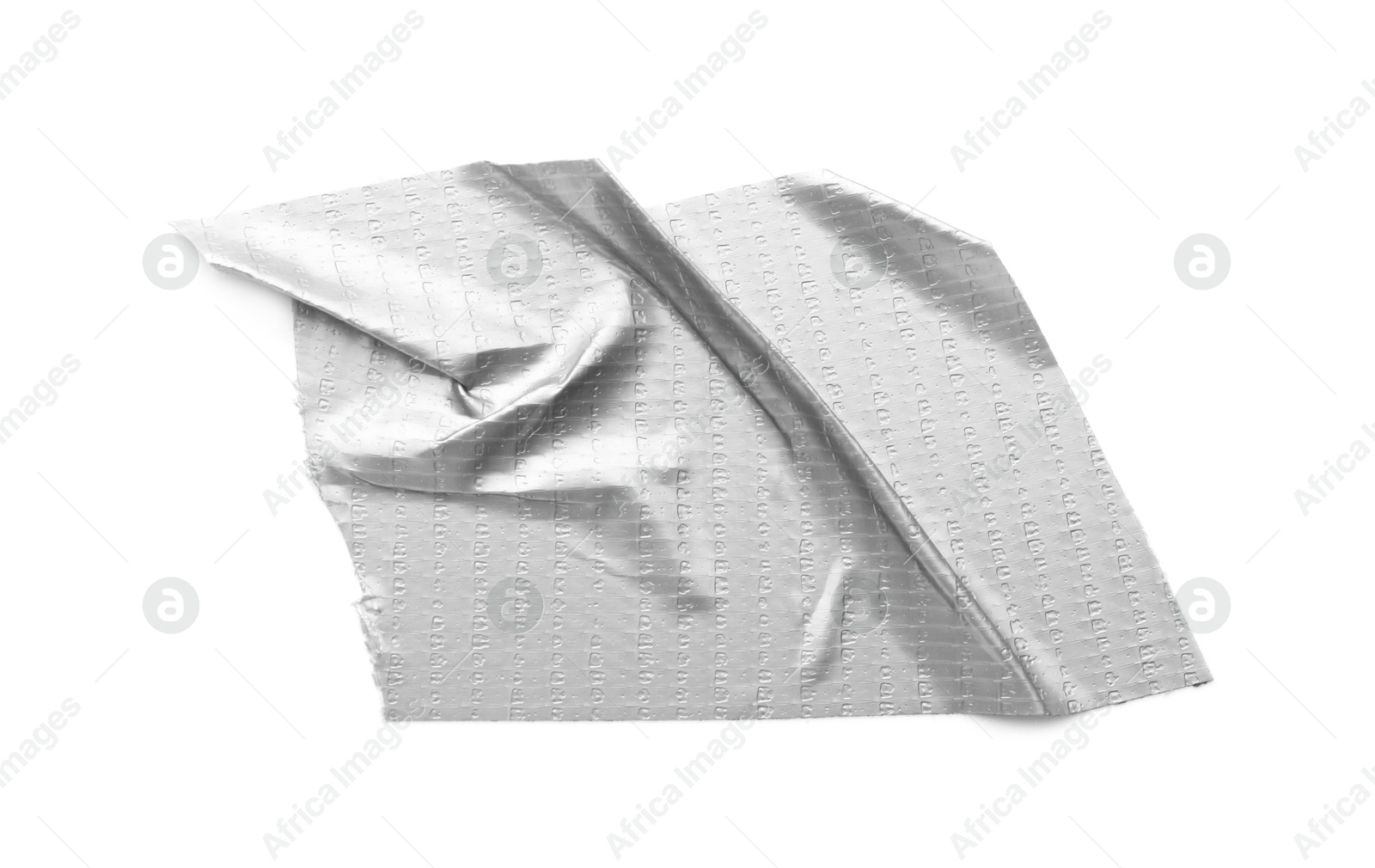 Photo of Wrinkled strip of silver adhesive tape on white background, top view