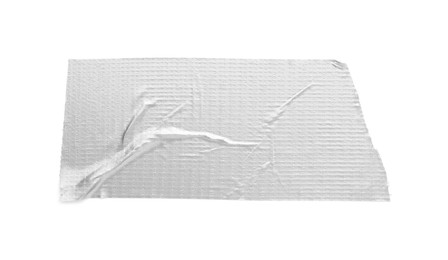 Photo of Strip of silver adhesive tape on white background, top view