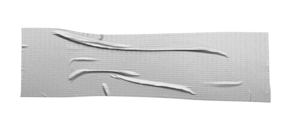 Photo of Strip of silver adhesive tape on white background, top view