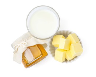 Photo of Jar of honey, milk in glass and butter isolated on white, top view