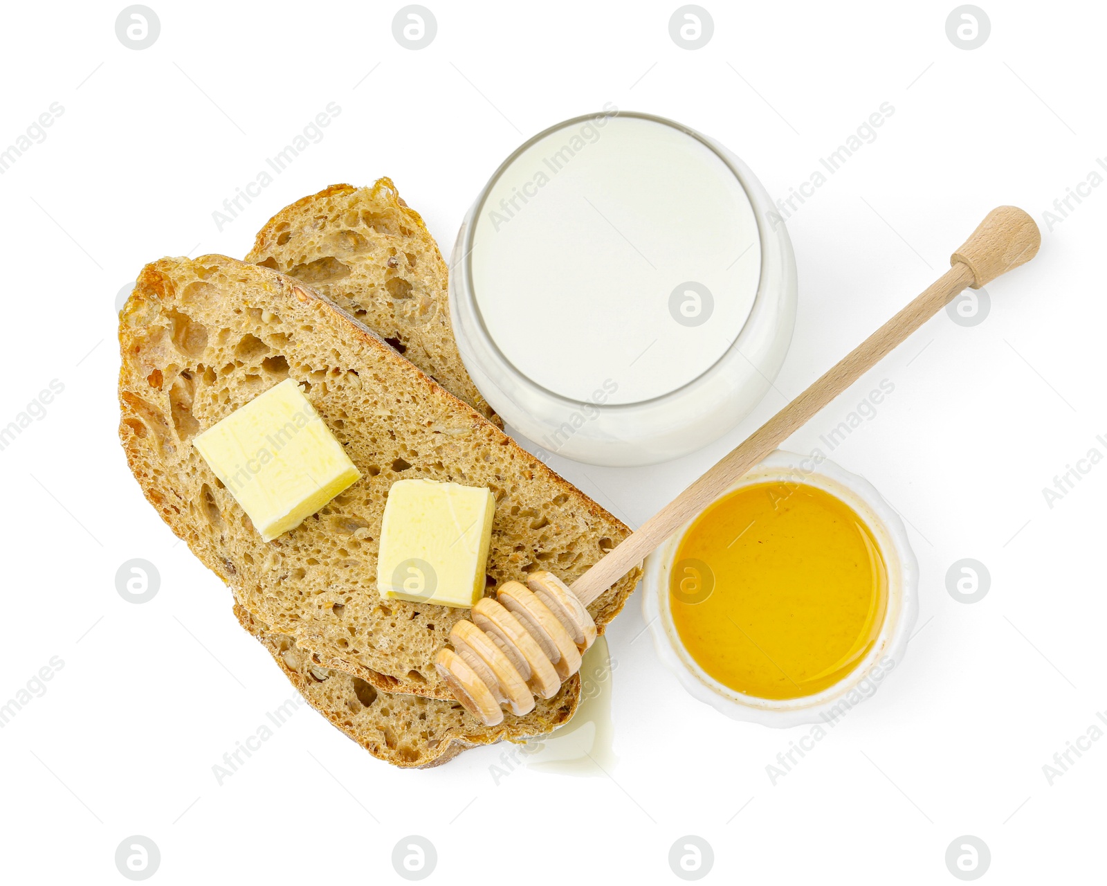 Photo of Slices of bread with butter, milk and honey isolated on white, top view