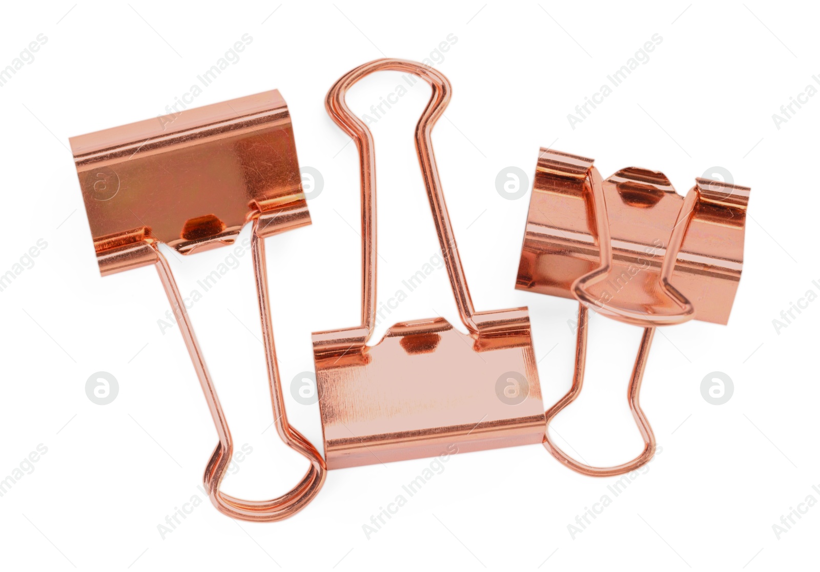 Photo of Golden binder clips isolated on white, top view