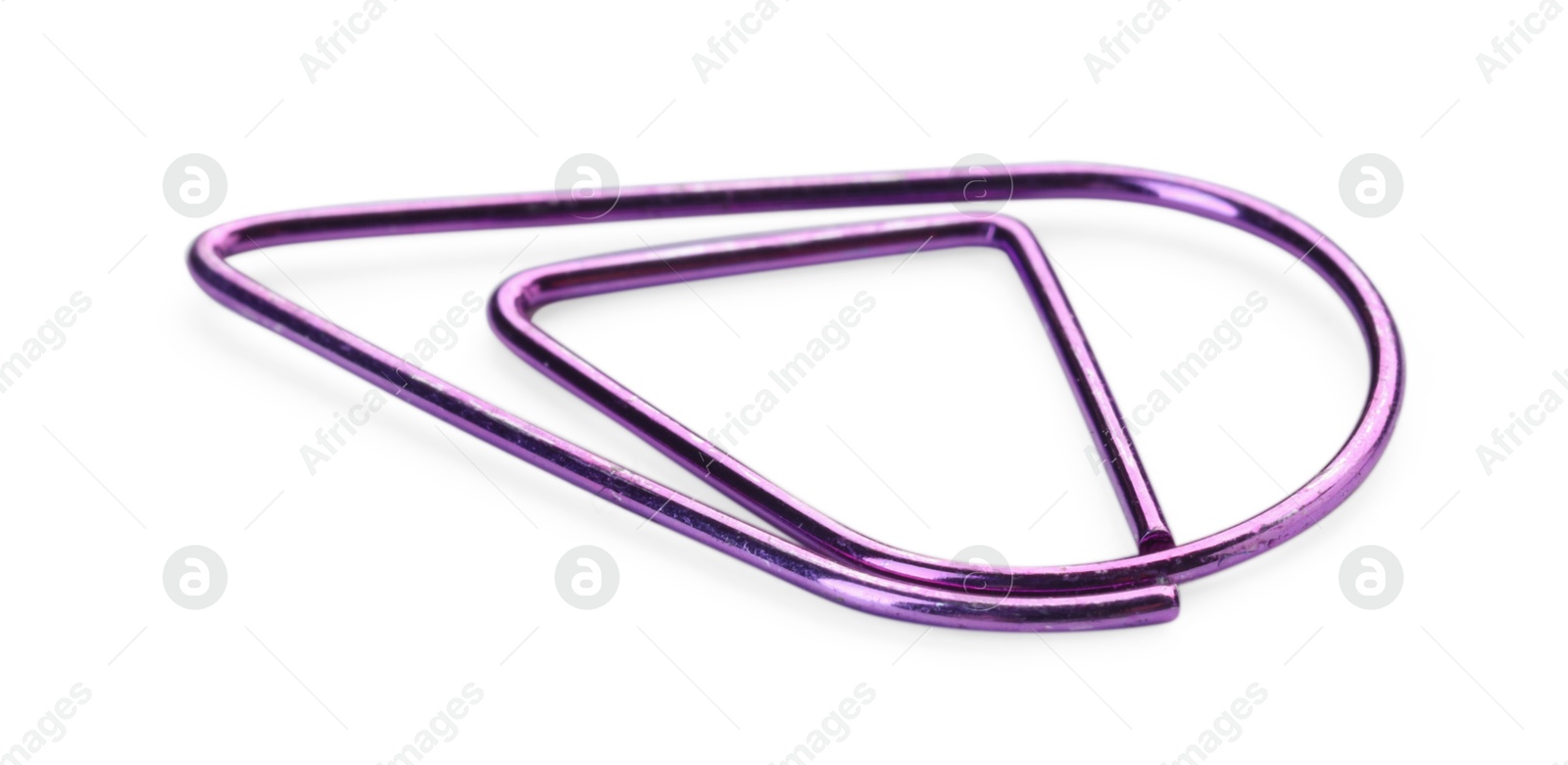 Photo of One purple paper clip isolated on white