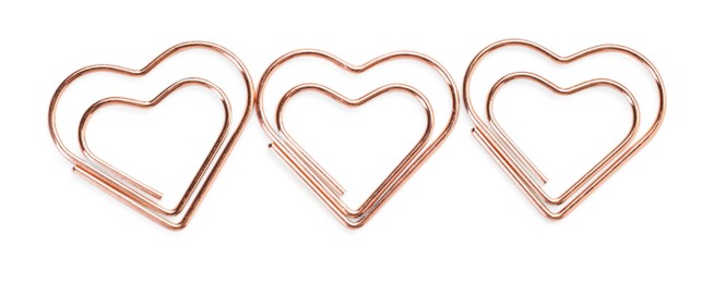 Photo of Heart shaped paper clips isolated on white, top view