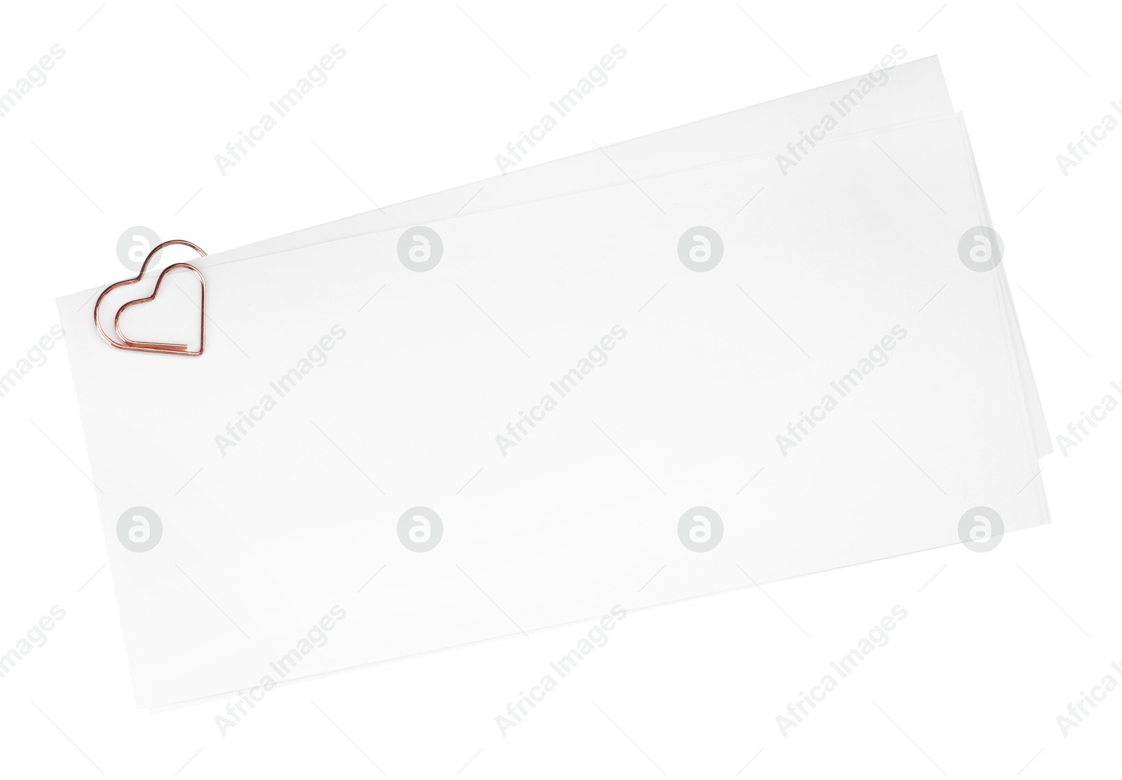 Photo of Blank paper sheet attached with clip isolated on white, top view