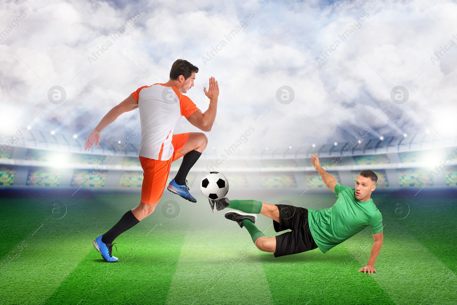 Image of Young men playing football under lights at stadium