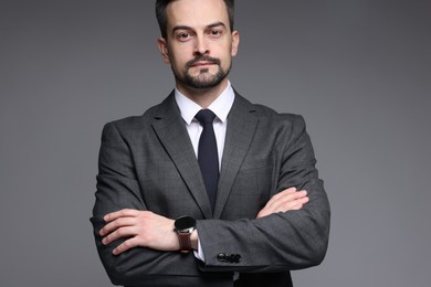 Photo of Confident man in classic suit on grey background