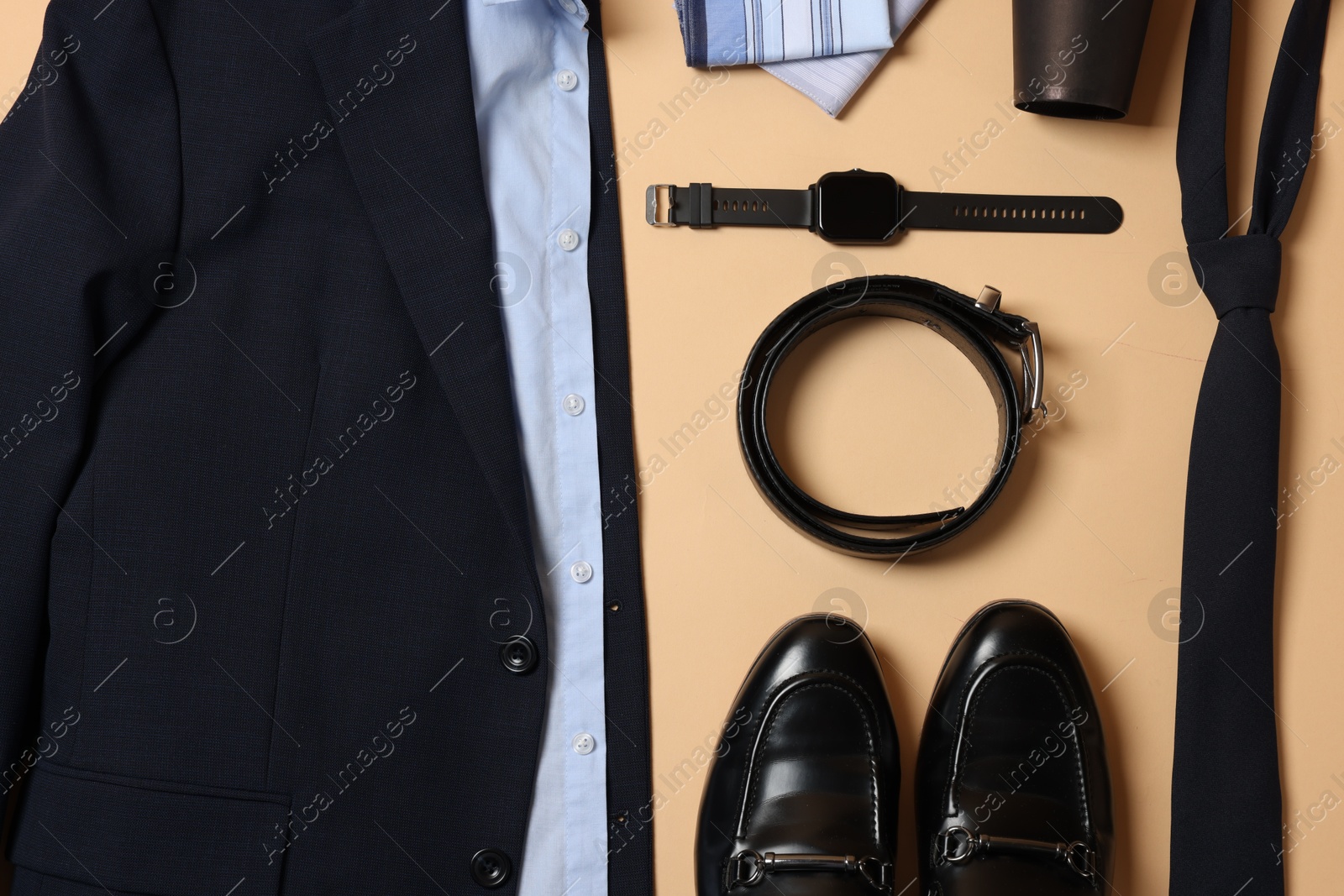 Photo of Elegant men's outfit. Stylish clothes, accessories and shoes on beige background, flat lay