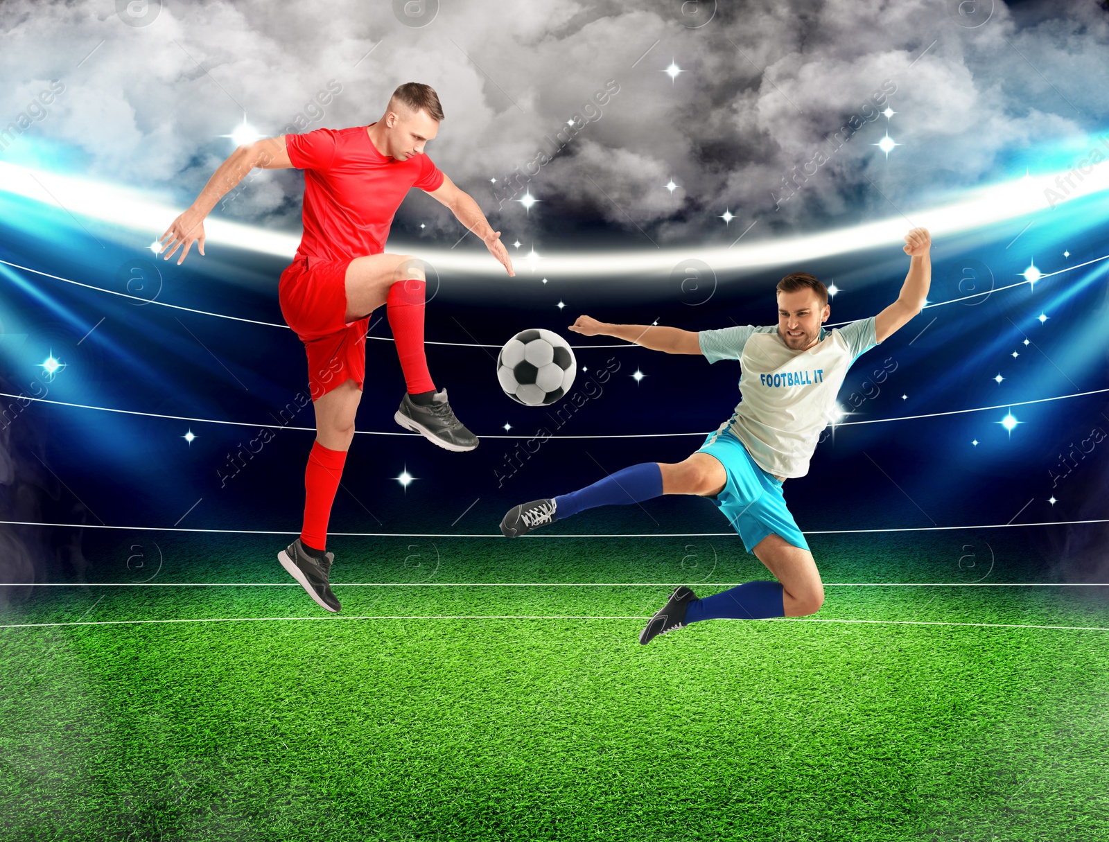 Image of Young men playing football under lights at stadium