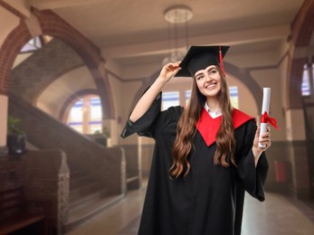 Image of Happy student in academic dress holding diploma after graduation in university