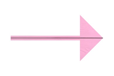 Image of Arrow with pink wooden texture isolated on white