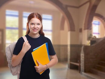 Image of Teenage student with notebooks and backpack in college