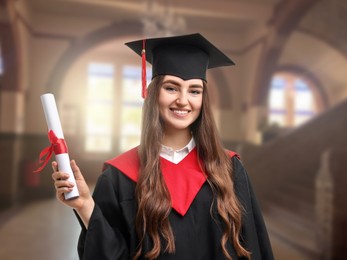 Image of Happy student in academic dress holding diploma after graduation in university