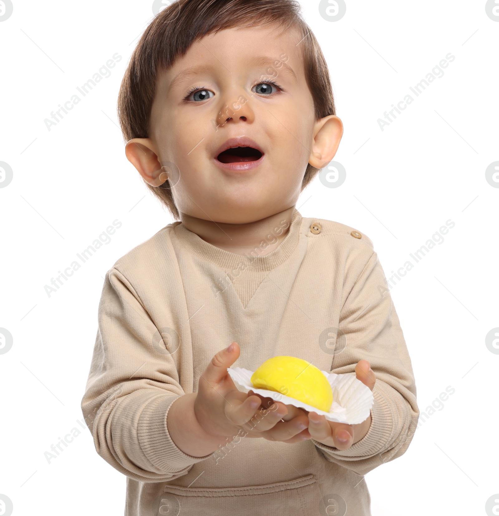 Photo of Cute little child with tasty mochi on white background