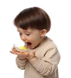 Photo of Cute little child with tasty mochi on white background