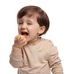 Photo of Cute little child eating tasty mochi on white background