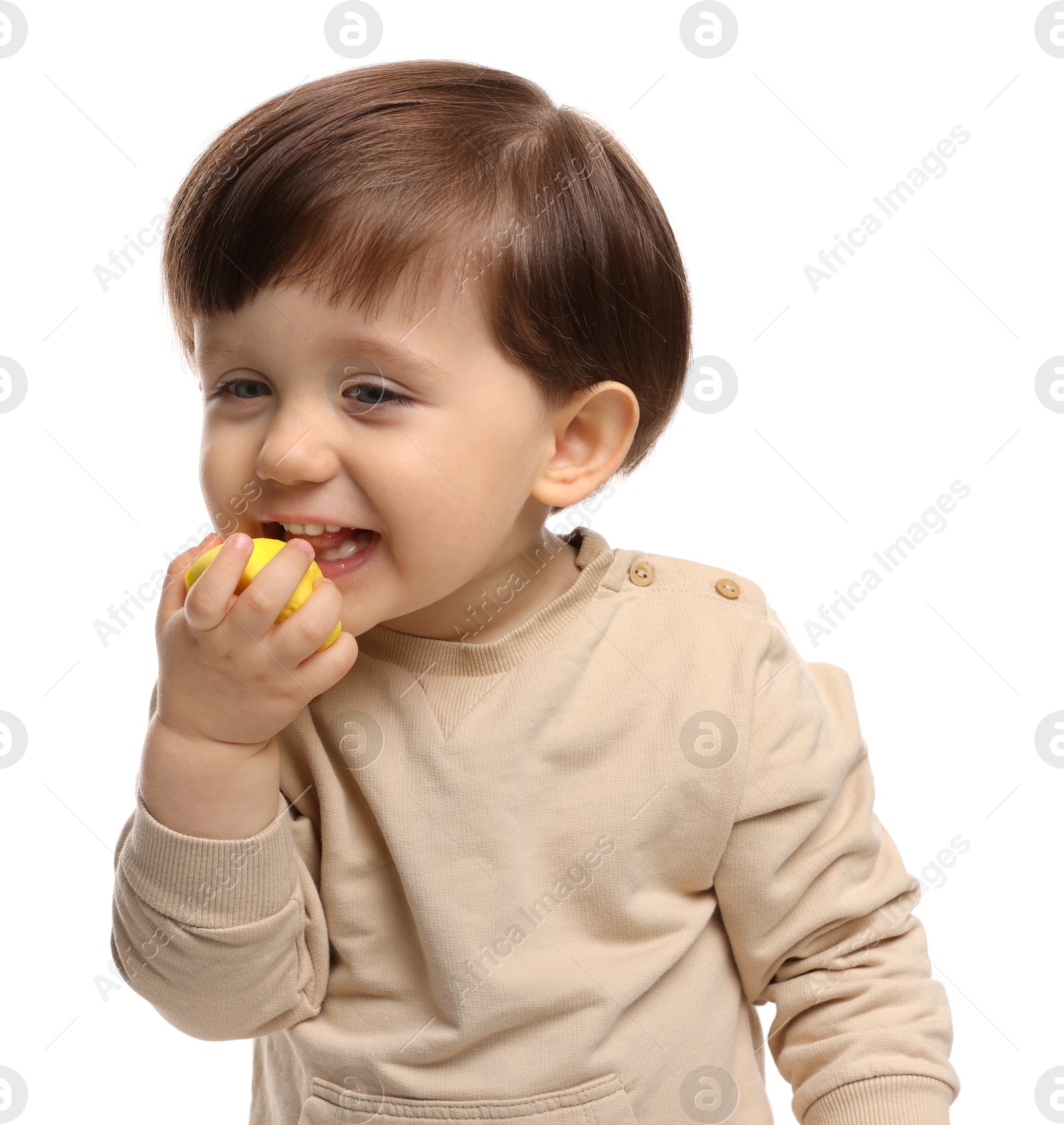 Photo of Cute little child eating tasty mochi on white background