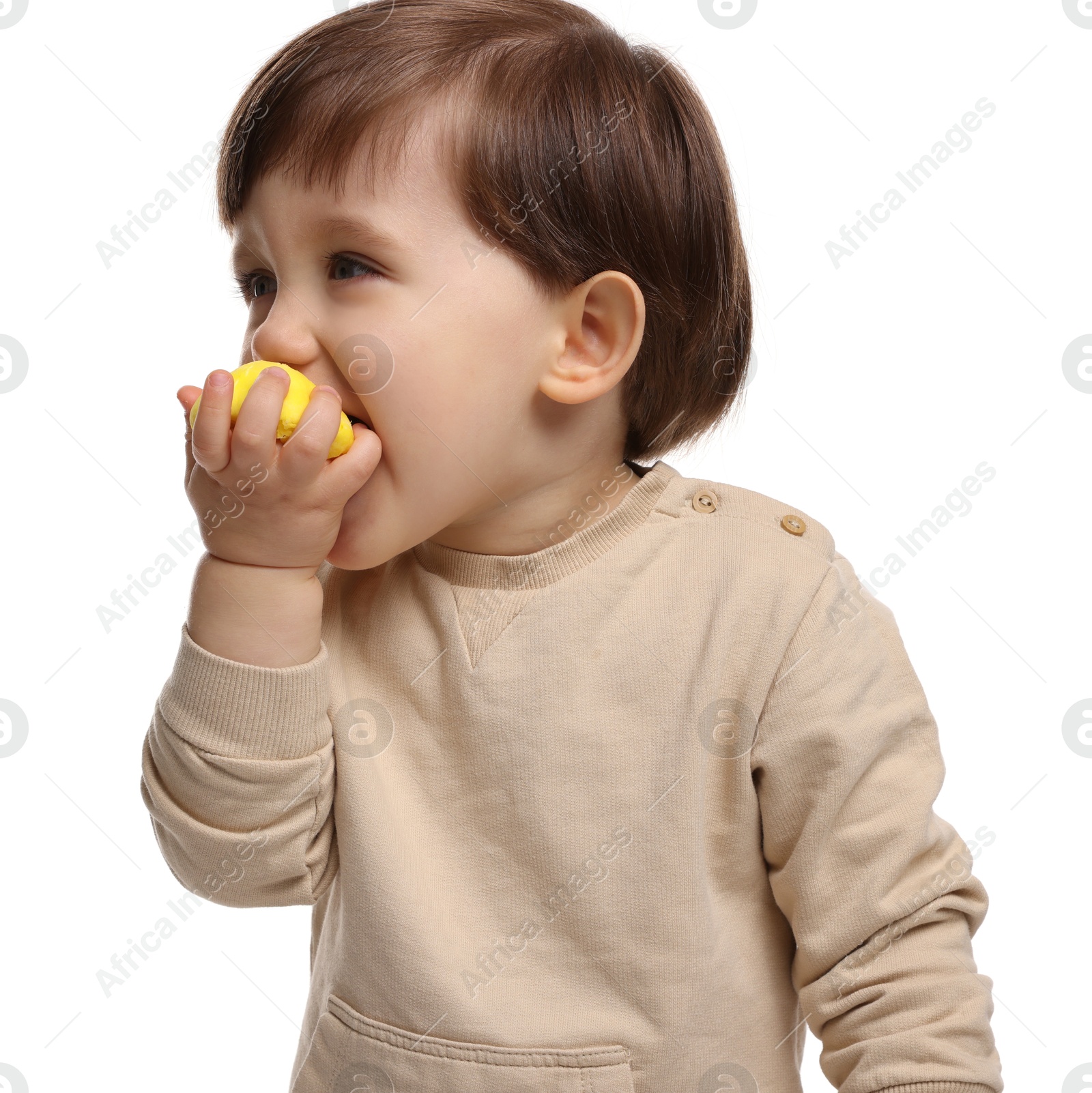 Photo of Cute little child eating tasty mochi on white background