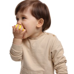 Photo of Cute little child eating tasty mochi on white background