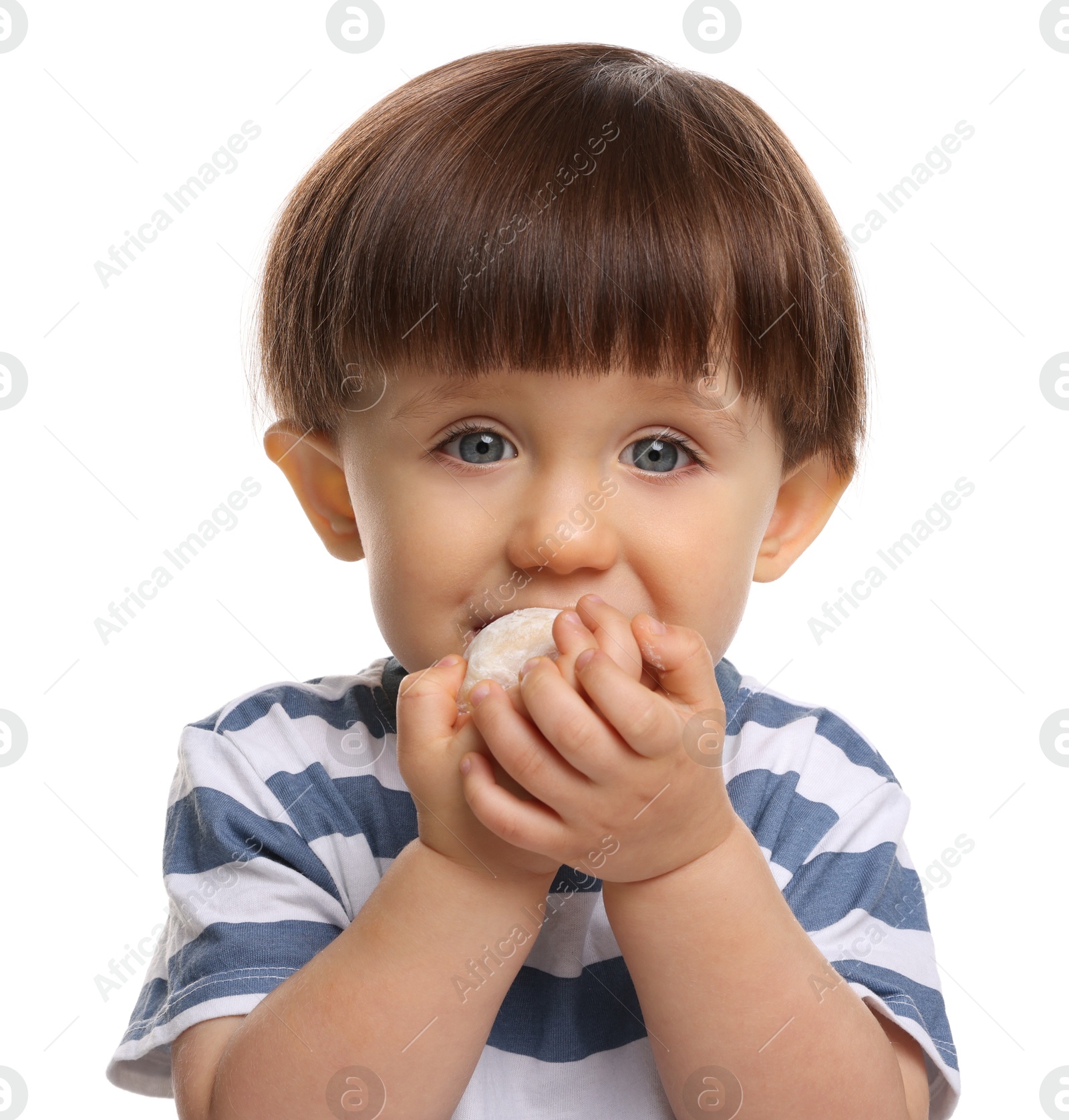 Photo of Cute little child eating tasty mochi on white background