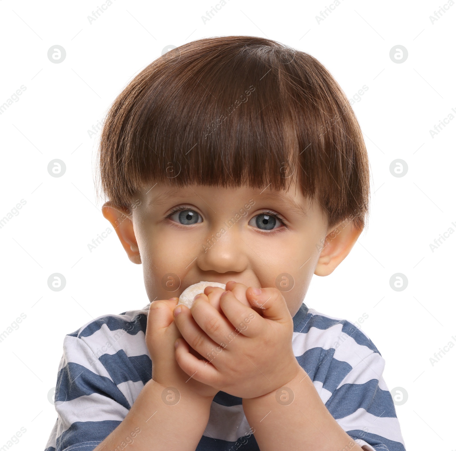 Photo of Cute little child eating tasty mochi on white background