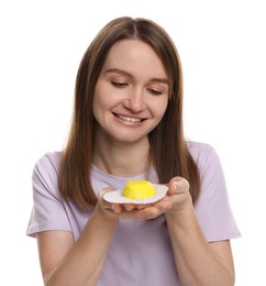 Photo of Woman with tasty mochi on white background