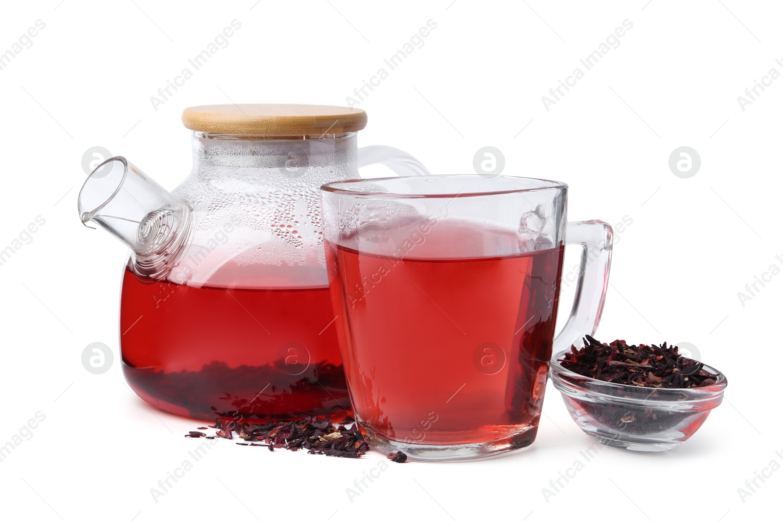 Photo of Tasty hibiscus tea in glass cup and teapot isolated on white