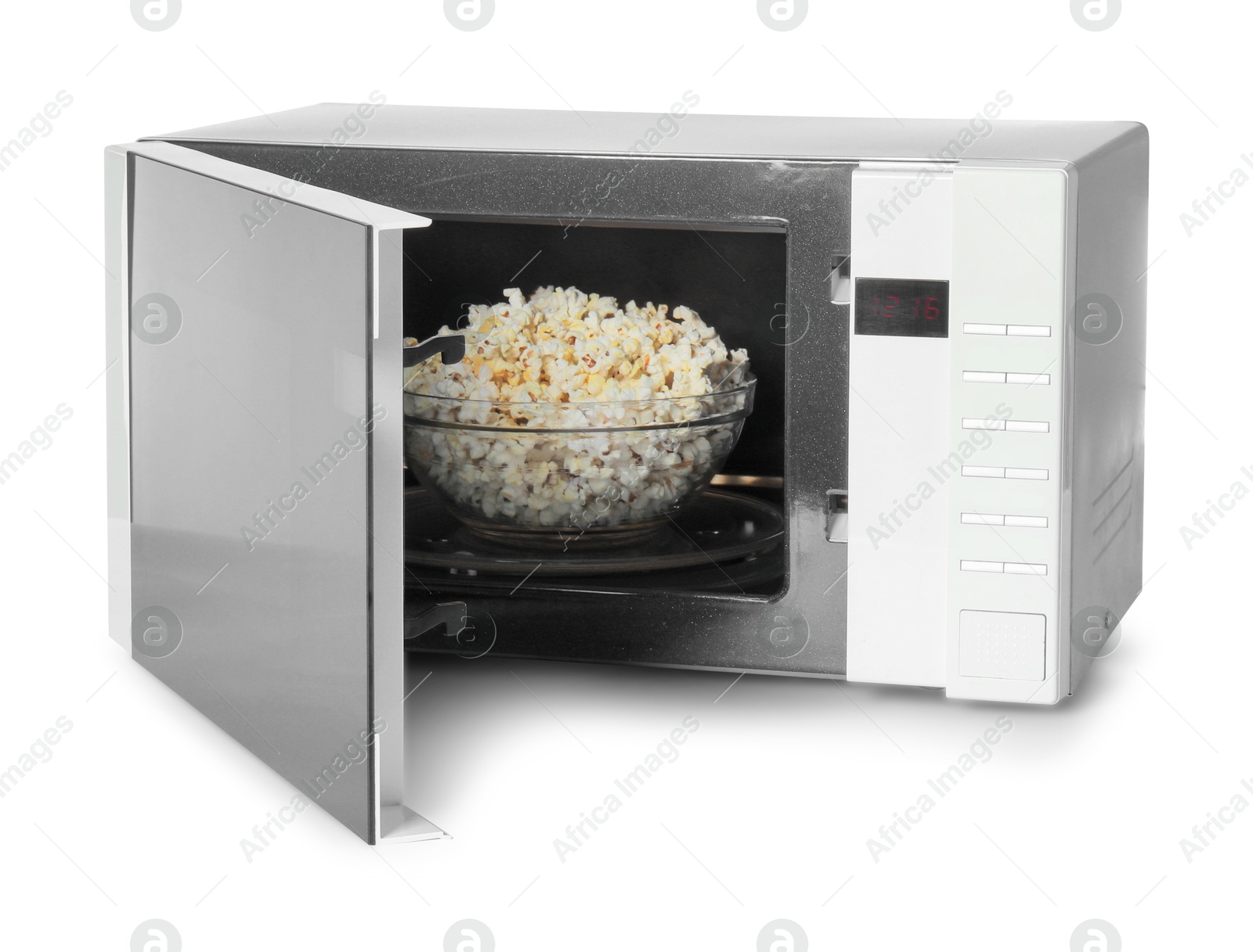 Photo of Open microwave oven with bowl of popcorn isolated on white