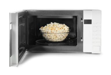 Photo of Open microwave oven with bowl of popcorn isolated on white