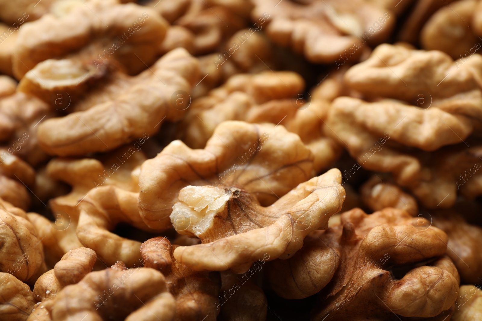 Photo of Pile of fresh ripe walnuts as background, closeup