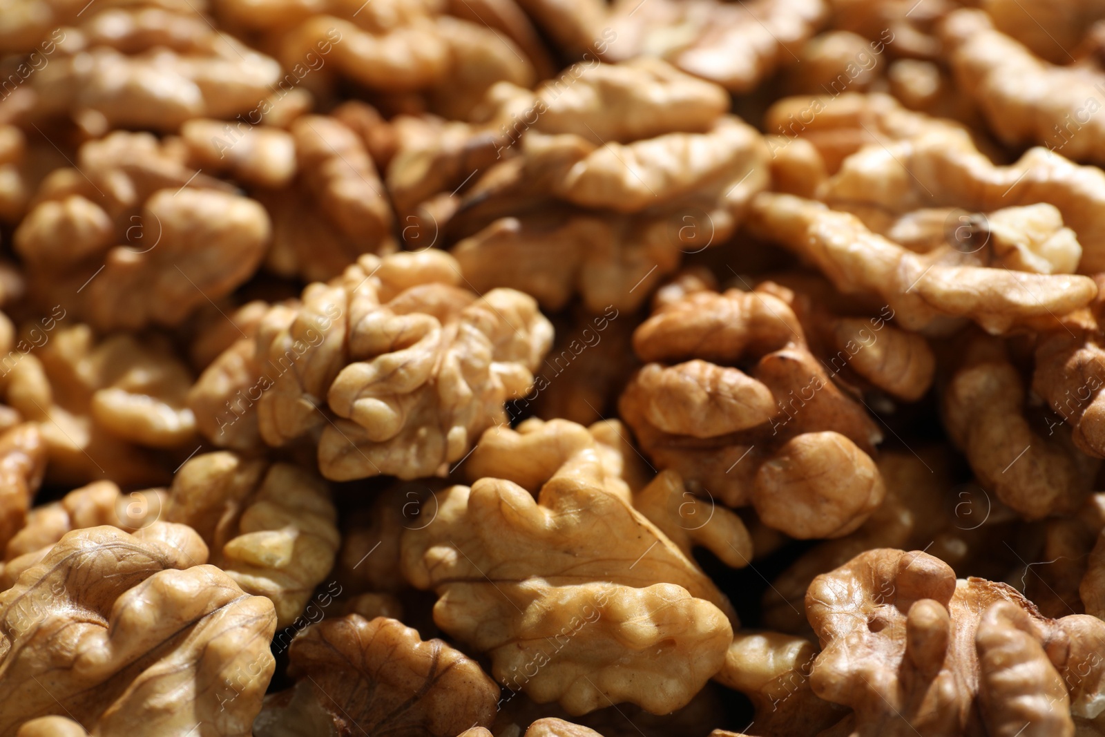 Photo of Pile of fresh ripe walnuts as background, closeup