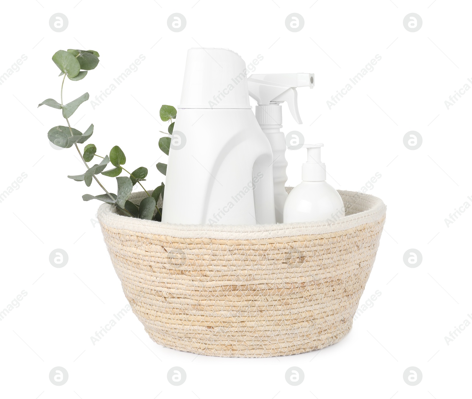 Photo of Eco-friendly cleaning products and eucalyptus branches in wicker basket isolated on white