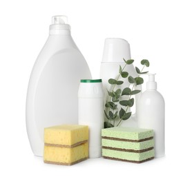 Photo of Eco-friendly cleaning products, sponges and eucalyptus branches isolated on white