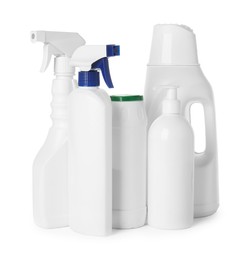 Photo of Bottles of different cleaning products isolated on white